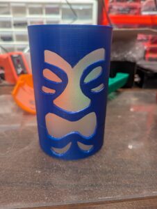 Front exterior view of a blue Tiki shade, with the diffuser glued in place. 
